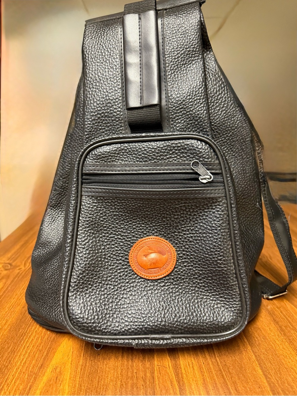 Dooney & Bourke Black Pebbled Leather Belt Bag with Tan Logo Patch